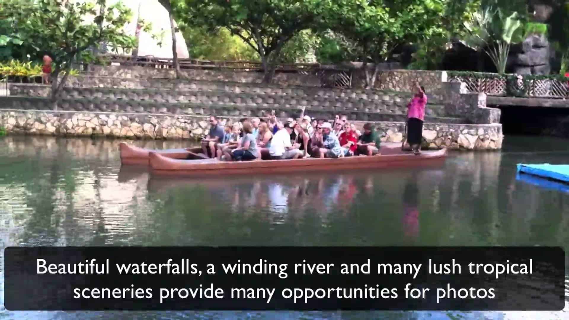 Visitors riding a canoe along the waterway at the Polynesian Cultural Center